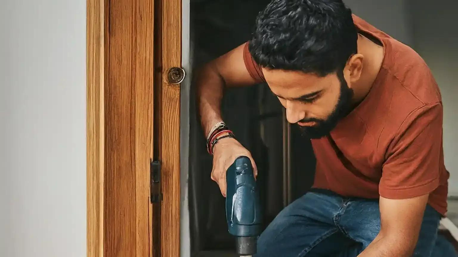 A guy working with tools to install Starlink satellite internet.